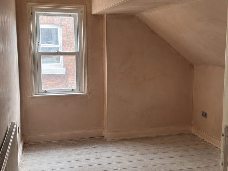 A wall bonded and prepared, ready for the skim coat