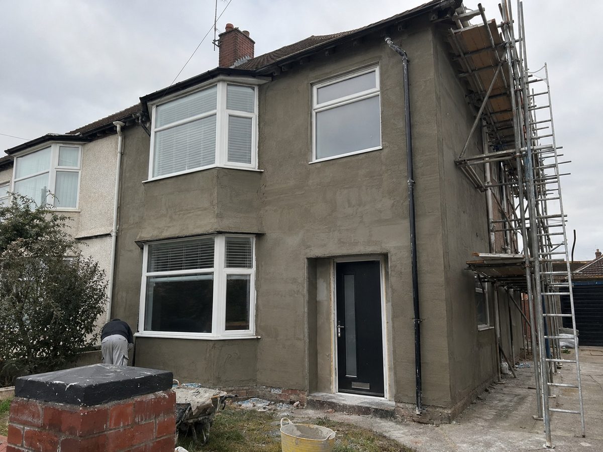 A rendered semi detached house seen from the pavement